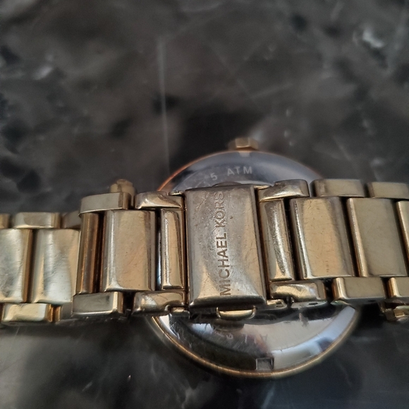 Ladies gold color MK logo watch,  rhinestone accent around dial